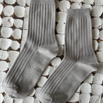 Her Socks in Stone