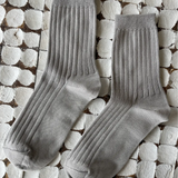 Her Socks in Stone