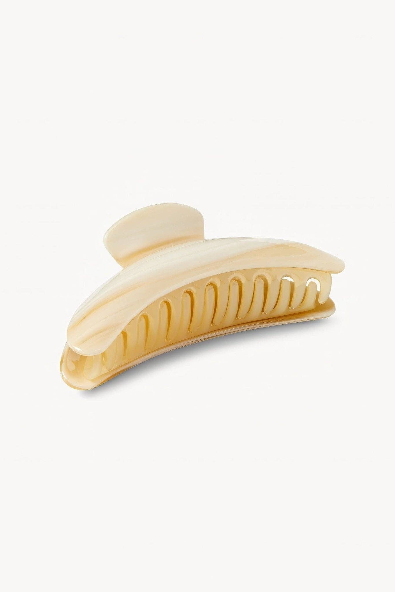 Beige hair clip on a white background