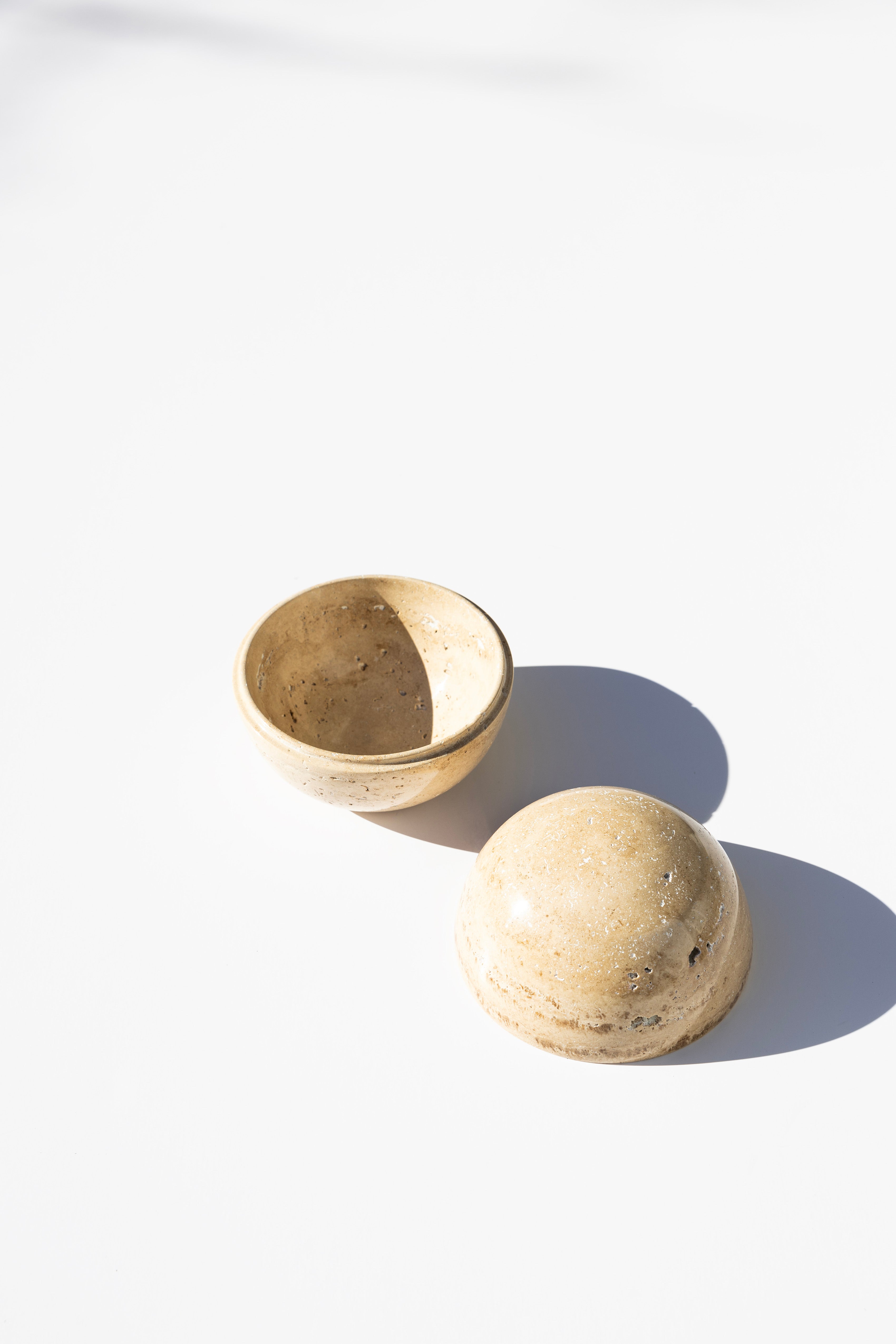 stone cylinder box, open against white background