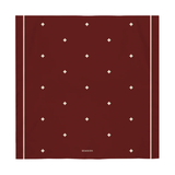 Burgundy scarf with white diamond pattern on a white background