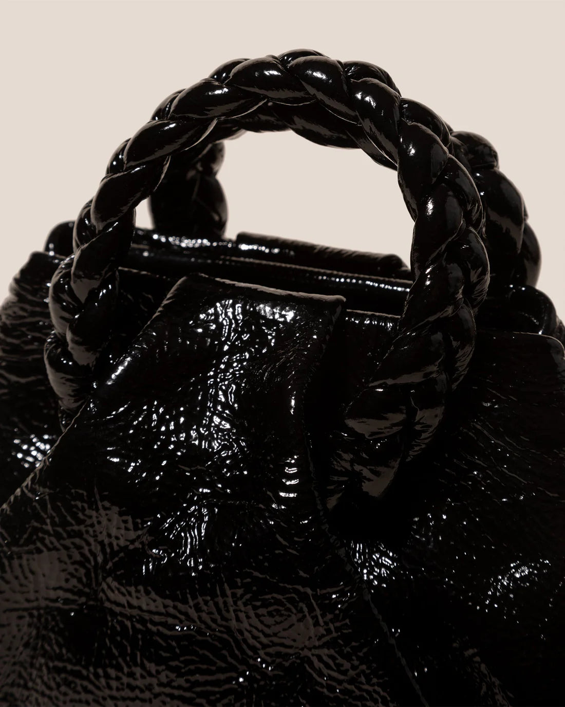 Handle of the Bombon Handbag - Crinkled Glossy Black