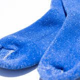 Blue socks with a textured finish on a white background