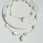 Pearl necklace on a white plate
