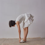 Emilia Dress - White model moving in dress