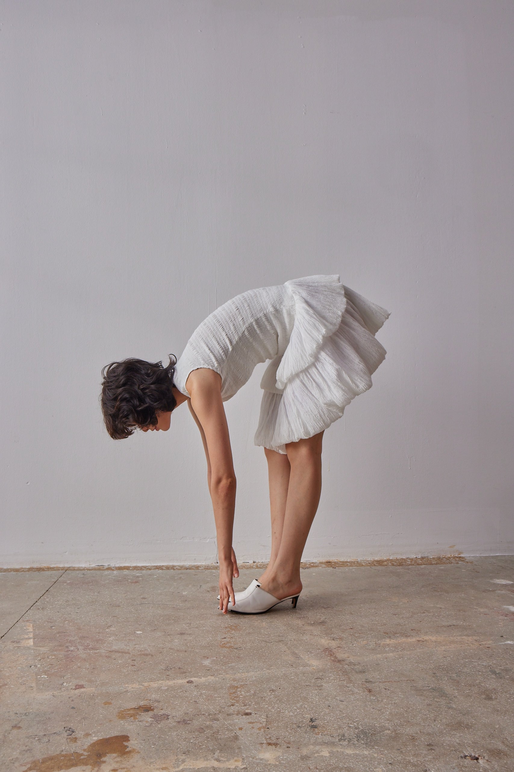 Emilia Dress - White model moving in dress