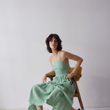 Holly Dress - Green on model in chair
