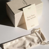 Breda box with a card and a watch pouch on a light surface