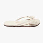 Beige sandal with a bow on a white background
