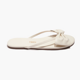 Beige sandal with a bow on a white background