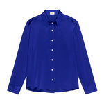 Blue shirt with white buttons on a white background