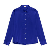 Blue shirt with white buttons on a white background