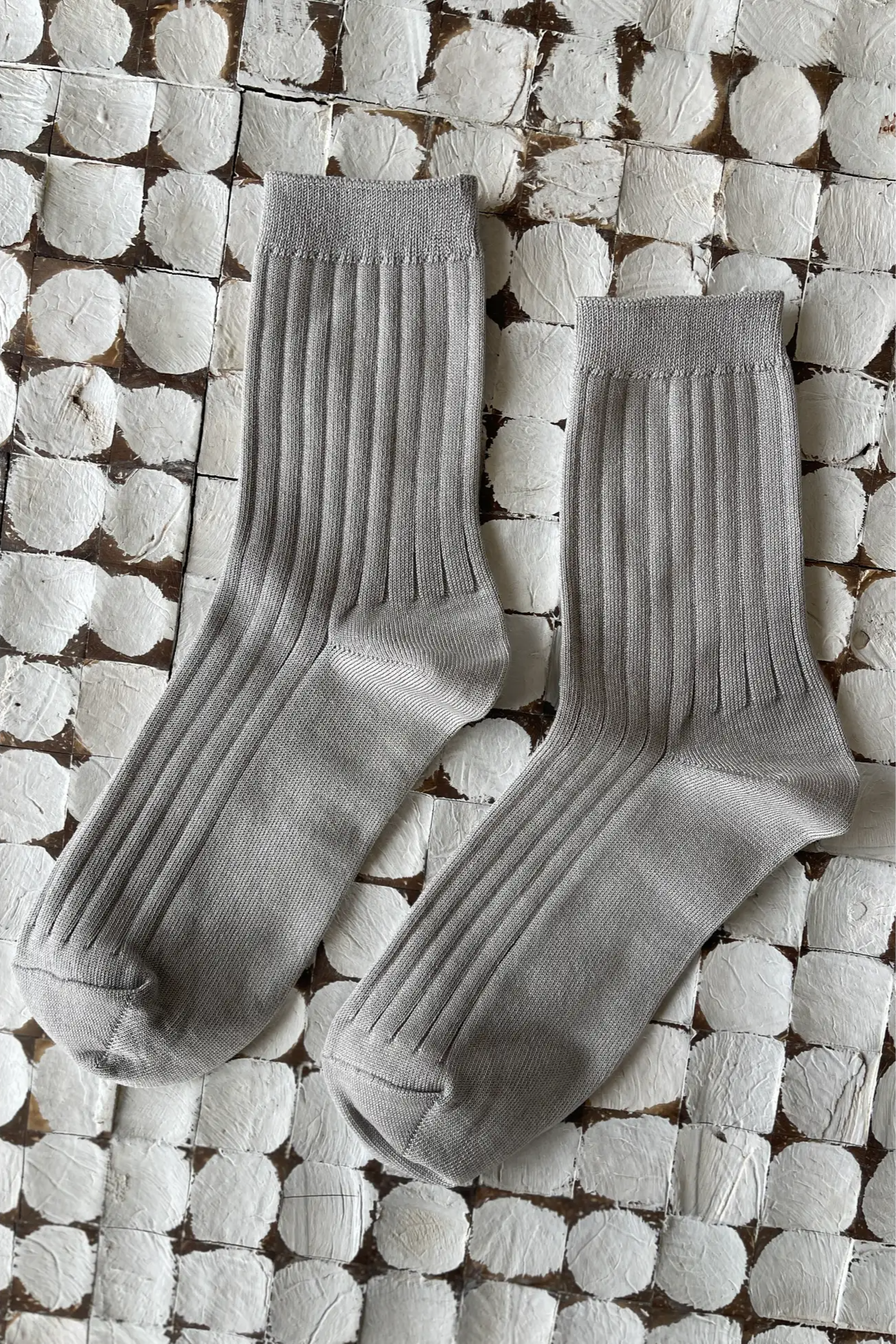 Her Socks in Stone