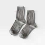 Her Socks in Stone