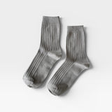Her Socks in Stone