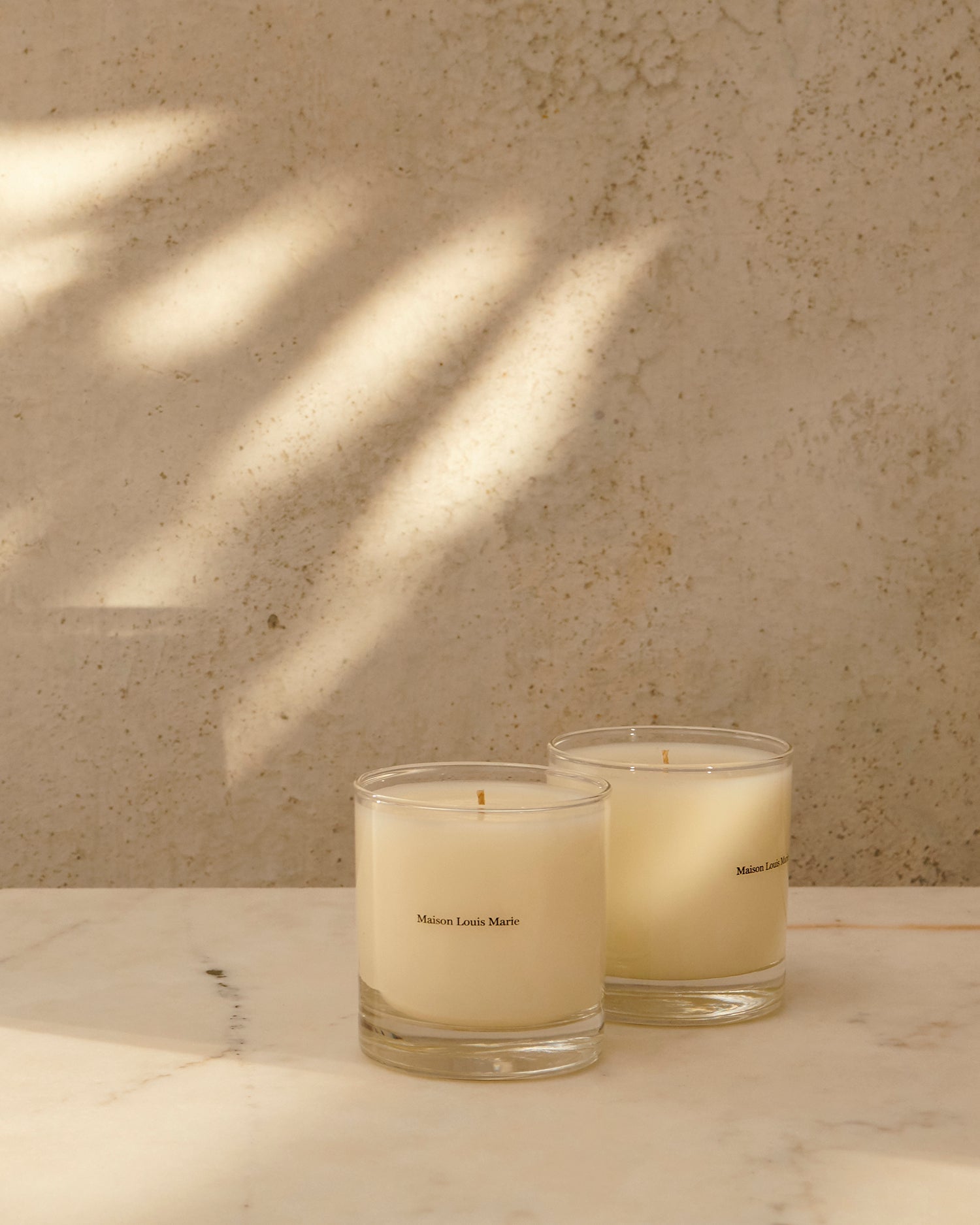 Maison Louis Marie No.03 L'Etang Noir Candle — lit candle mood shot