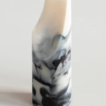 Marble-patterned soap on a white background