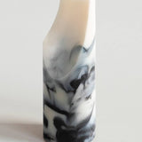 Marble-patterned soap on a white background