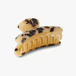 Tortoise print hair clip on a white background