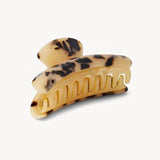Tortoise print hair clip on a white background