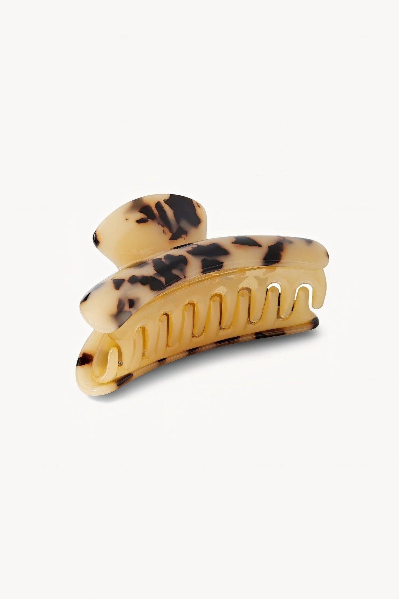 Tortoise print hair clip on a white background