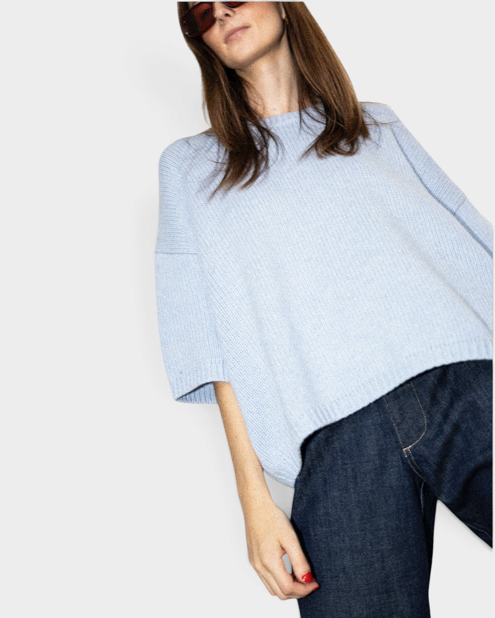JONES + CO oversized heathered blue crew-neck sweater with short sleeves and dropped shoulders worn by a model