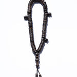 Wooden rosary on a white background