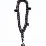 Wooden rosary on a white background