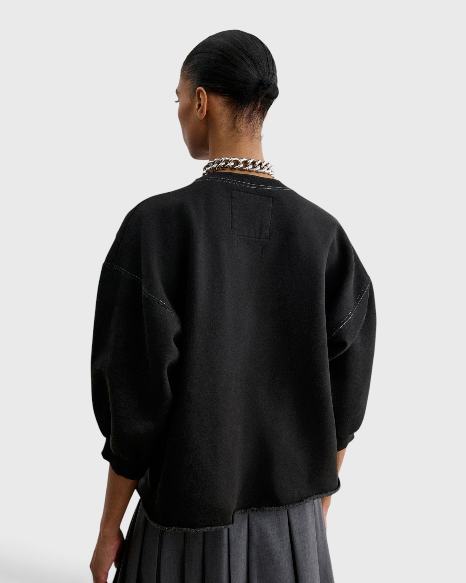JONES + CO Rachel Comey Fond Sweatshirt in charcoal, back view with raw edge hem
