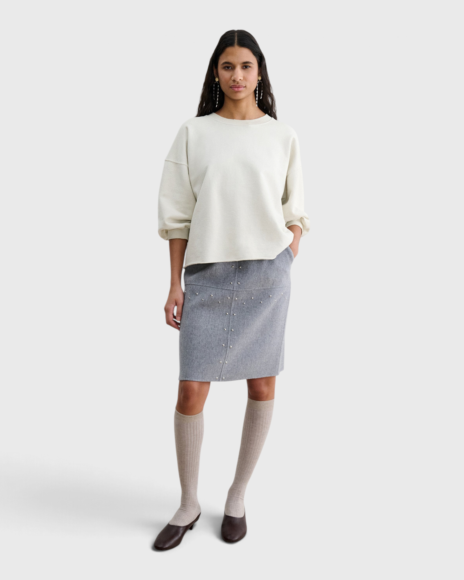 JONES + CO Rachel Comey Fond Sweatshirt in dirty white, full-length front view styled with a grey skirt