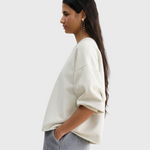 JONES + CO Rachel Comey Fond Sweatshirt in dirty white, side profile view