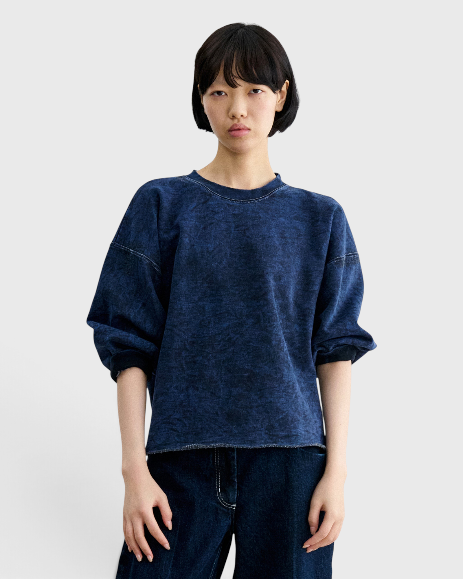 JONES + CO Rachel Comey Fond sweatshirt in acid wash indigo, close-up front view with dropped shoulders.