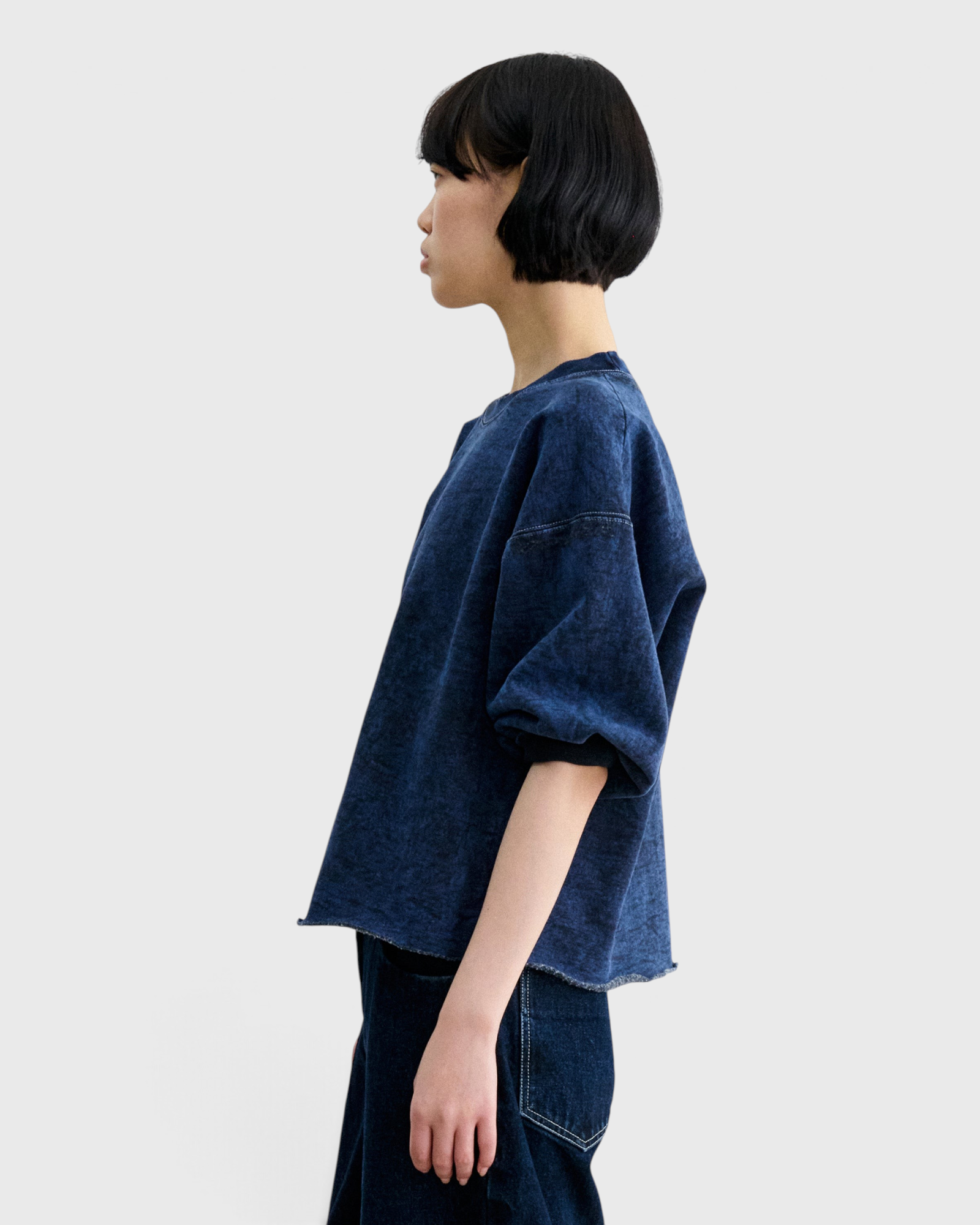 JONES + CO Rachel Comey Fond sweatshirt in acid wash indigo, side profile view.