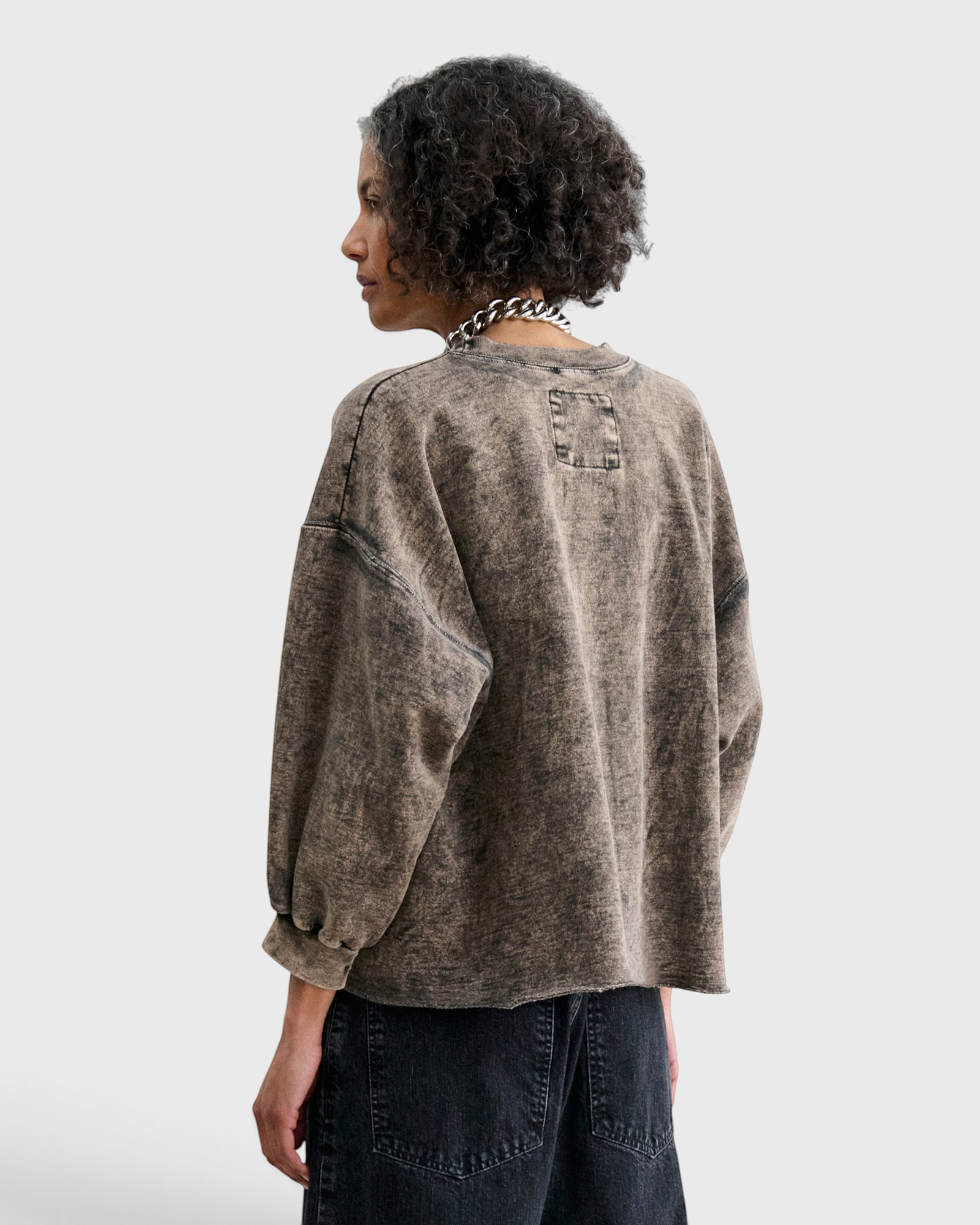 JONES + CO Rachel Comey Fond sweatshirt in smoky hazelnut acid-overdyed cotton, back view showing raw-edge hem.