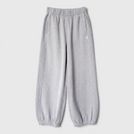 JONES + CO melange grey French terry balloon pants with an elastic high waist and gathered leg openings.