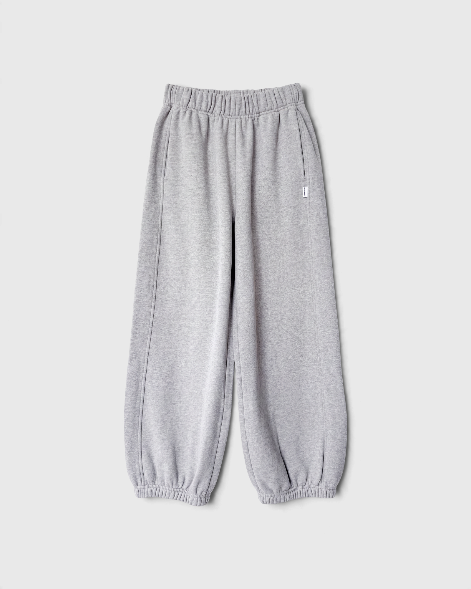 JONES + CO melange grey French terry balloon pants with an elastic high waist and gathered leg openings.