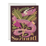 Greeting card with a stylized snake and leaves design on a purple background, featuring the text 'Stay Fierce'.