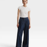 JONES + CO Coxsone high-waisted wide-leg pleated trousers in dark indigo Vista denim, full-length front view.