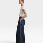 JONES + CO Coxsone dark indigo denim trousers, side view showing wide leg.