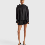Merlette Majorelle Top in Black - full-length front view of the smocked pima cotton lawn blouse