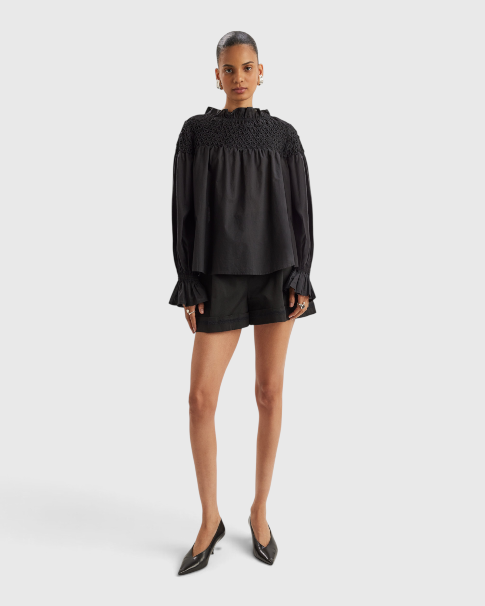 Merlette Majorelle Top in Black - full-length front view of the smocked pima cotton lawn blouse