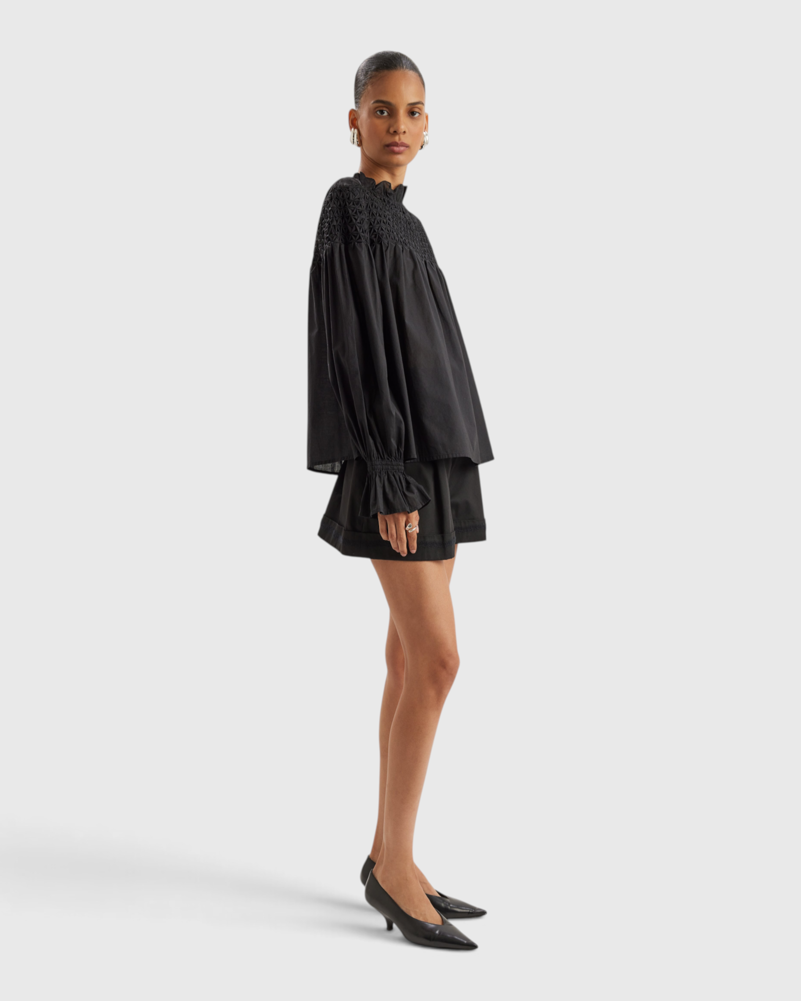 Merlette Majorelle Top in Black - side view showing the volume through the body and sleeves