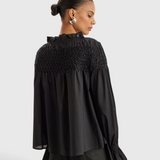 Merlette Majorelle Top in Black - back view showing the hand smocked yoke