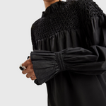 Merlette Majorelle Top in Black - close detail of the smocked yoke and elasticated ruffled cuff