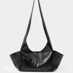 RACHEL COMEY Tool Bag in black lustre cow leather, front view with fixed shoulder strap.