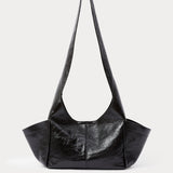 RACHEL COMEY Tool Bag in black lustre cow leather, front view with fixed shoulder strap.