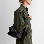 RACHEL COMEY Tool Bag in black leather, interior view with magnetic closure.