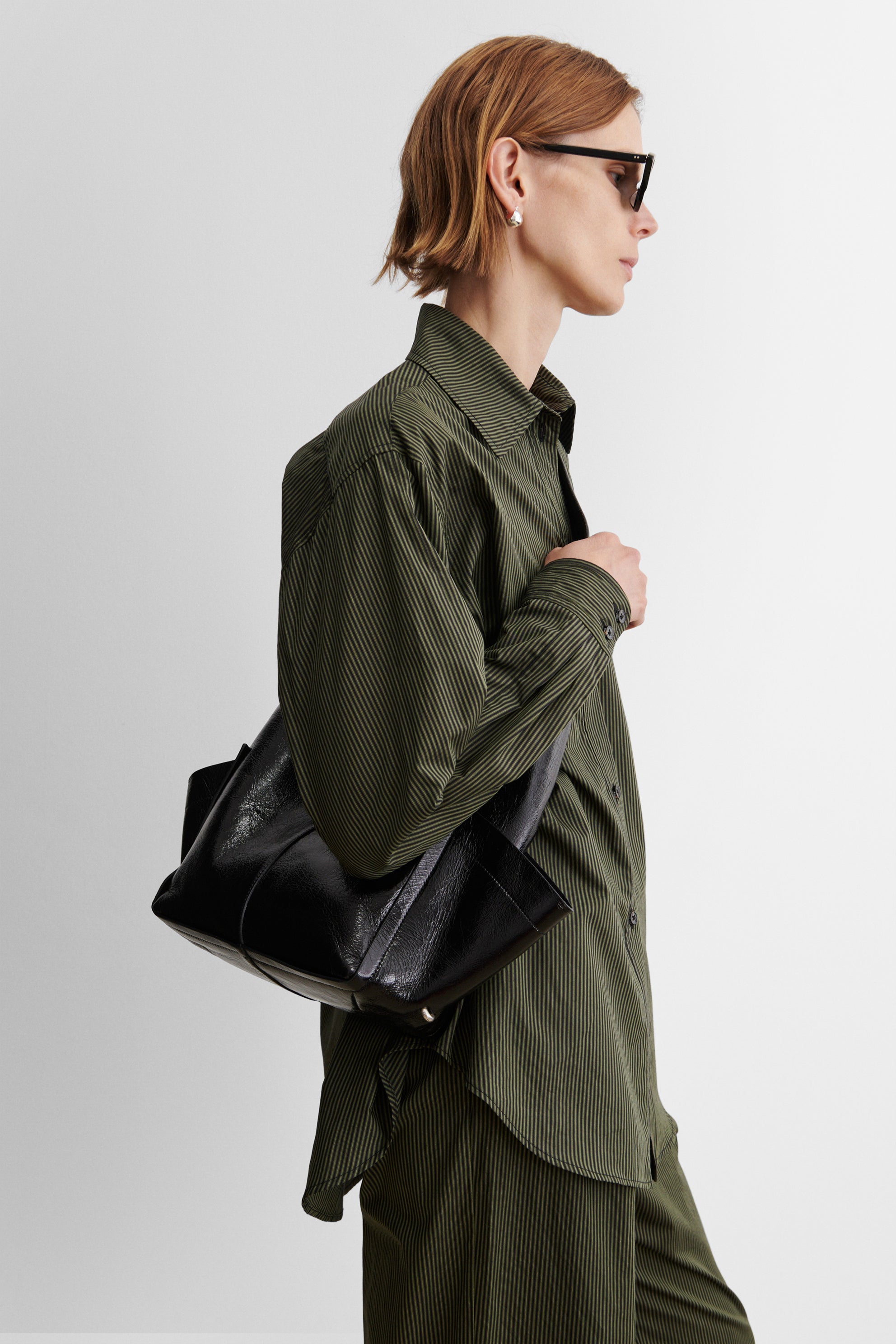 RACHEL COMEY Tool Bag in black leather, interior view with magnetic closure.