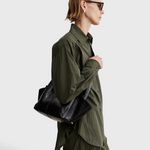 RACHEL COMEY Tool Bag in black leather, interior view with magnetic closure.