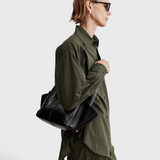 RACHEL COMEY Tool Bag in black leather, interior view with magnetic closure.